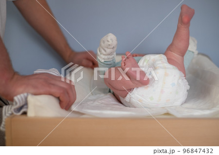 Newborn Baby legs on the changing table Newborn Baby legs on the changing table 96847432
