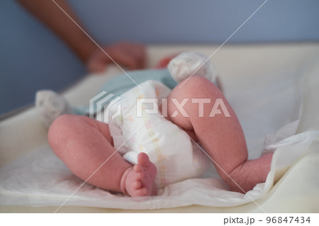 Newborn Baby legs on the changing table Newborn Baby legs on the changing table 96847434