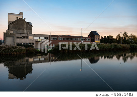 Wilsele, Flemish Brabant, Belgium,  Reflection of industrial buildings in the canal during sunset 96851482