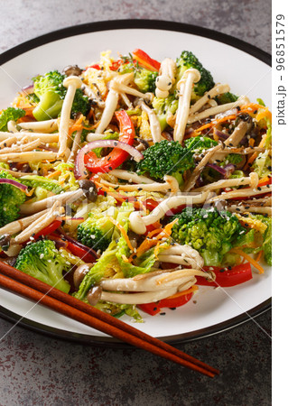 plate of stir fried vegetables with shimeji beech mushrooms closeup. Vertical 96851579