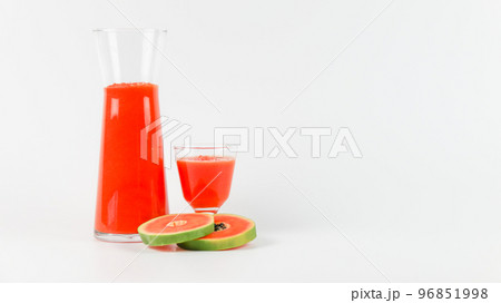 Papaya smoothie in glass jar and glasses on white background diet vegetarian healthy and freshness drink concept soft and selective focus 96851998