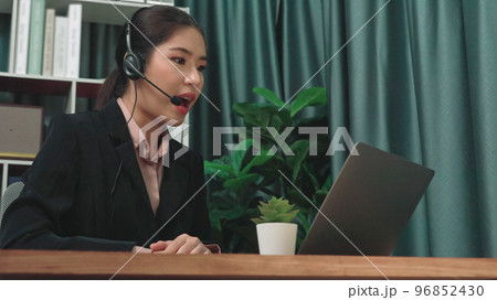 Enthusiastic female operator provide helpful customer service to customer. Enthusiastic female operator provide helpful customer service to customer. 96852430