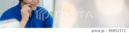 Business people wearing headset working in office in widen view Business people wearing headset working in office in widen view 96852572