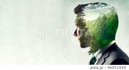 Concept of green business devotion shown by businessman and green forest trees Concept of green business devotion shown by businessman and green forest trees 96852889