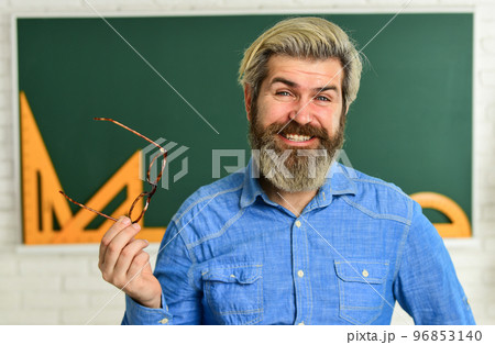 stylish trendy teacher. happy teacher in glasses. check knowledge of student. are you ready for exam test. man tutor in classroom. use math tool and blackboard. back to school. elementary mathematics stylish trendy teacher. happy teacher in glasses. check knowledge of student. are you ready for exam test. man tutor in classroom. use math tool and blackboard. back to school. elementary mathematics 96853140