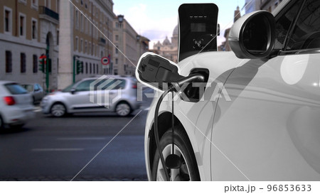 Progressive electric car recharging battery at the charging station in Vatican. Progressive electric car recharging battery at the charging station in Vatican. 96853633