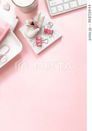 A feminine workspace, keyboard of a computer on pink background with copy space A feminine workspace, keyboard of a computer on pink background with copy space 96856644
