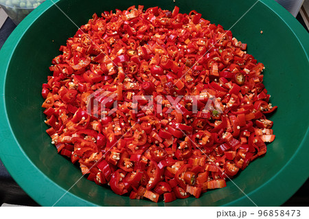 Many chopped big red peppers Many chopped big red peppers 96858473