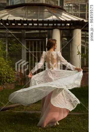 A young beautiful bride in a long boho wedding dress. 96859575