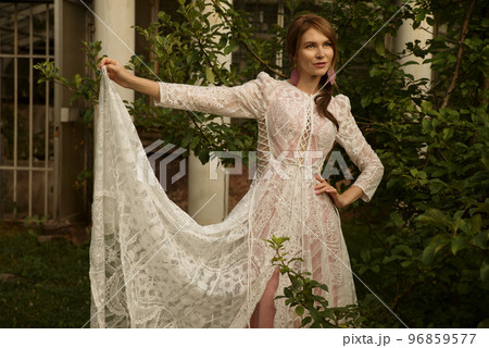 A young beautiful bride in a long boho wedding dress. 96859577