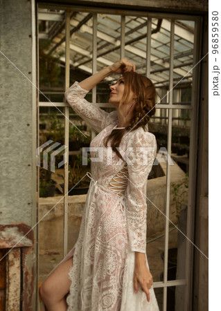 A young beautiful bride in a long boho wedding dress. 96859580