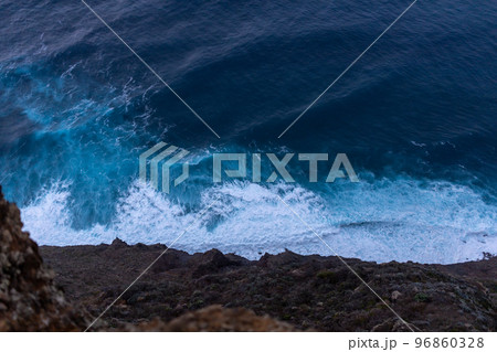 ocean surf waves at sunset view from above 96860328