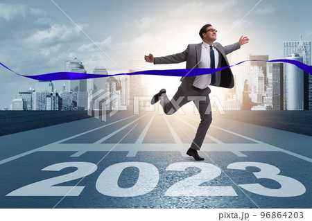 Businessman running to new 2023 year Businessman running to new 2023 year 96864203