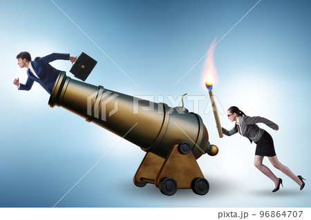 Concept of lay-off with business people and cannon 96864707