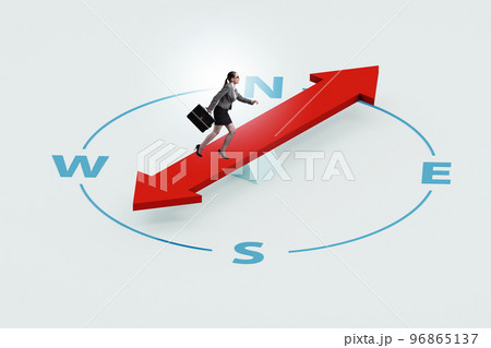 Businesswoman with compass looking for direction Businesswoman with compass looking for direction 96865137