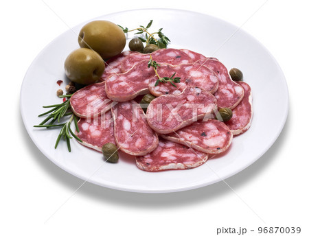 slices of Spanish Fuet thin dried salami sausage on white ceramic plate isolated on a white background 96870039