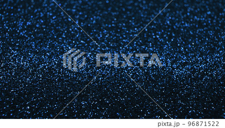 Bokeh light background. Blur glitter texture. Fantasy glare. Defocused blue color shiny sparkles glow reflection on dark black abstract free space poster. Bokeh light background. Blur glitter texture. Fantasy glare. Defocused blue color shiny sparkles glow reflection on dark black abstract free space poster. 96871522