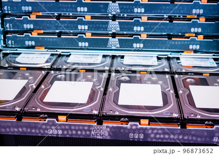 Replacing a hard drive in a web server. Many disk drives are in the computer equipment of the data center. Replacing a hard drive in a web server. Many disk drives are in the computer equipment of the data center. 96873652