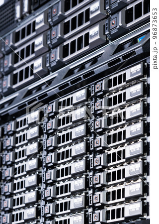 Row of hard drives serving as data storage inside server room Row of hard drives serving as data storage inside server room 96873653