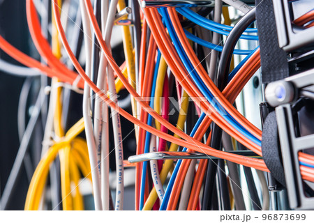 Detail of server room with bunch of fiber optic cables 96873699
