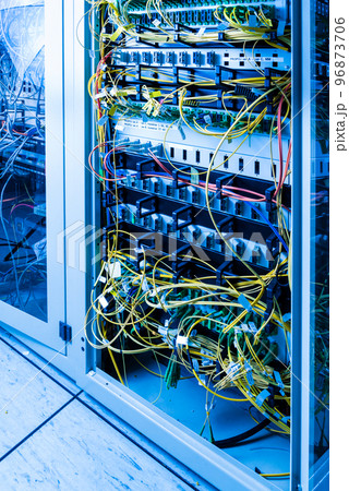 server inside data center with ethernet cables connected to data switch 96873706