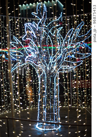 Glowing colorful figure of lights, Festive decoration of the city at night for Christmas. Glowing colorful figure of lights, Festive decoration of the city at night for Christmas. 96875453
