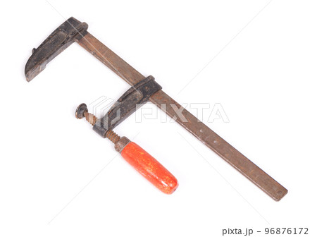 Big old metal clamp or Joiner clamp wood tools, isolated Big old metal clamp or Joiner clamp wood tools, isolated 96876172