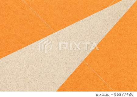 Texture of old craft orange color paper background with beige line, macro. Vintage abstract ginger cardboard 96877436