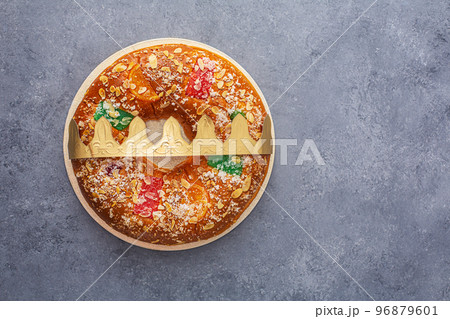Roscon is a traditional Spanish Christmas pastry prepared with dought Roscon is a traditional Spanish Christmas pastry prepared with dought 96879601
