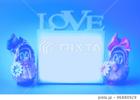 Two funny gnomes and love frame on a blue background 96880929