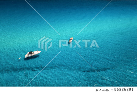 Aerial view of beautiful luxury yacht and boat in blue sea Aerial view of beautiful luxury yacht and boat in blue sea 96886891