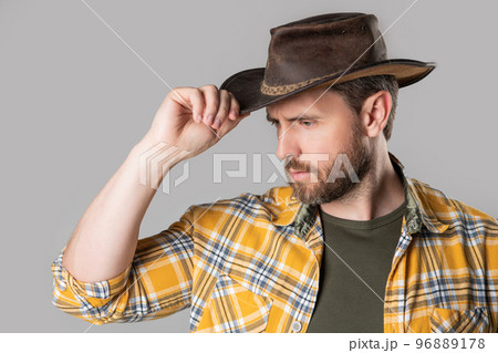 west man with cowboy hat isolated on grey background. west man in cowboy hat in studio. 96889178