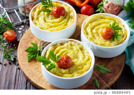 Thanksgiving Turkey dinner. Baked potatoes with turkey meat, potato casserole close-up on a wooden table. The concept of food on thanksgiving. 96889465