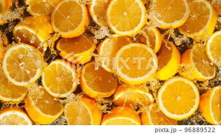 Freeze Motion Shot of Splashing Fresh Lemons, Close-up. Freeze Motion Shot of Splashing Fresh Lemons, Close-up. 96889522