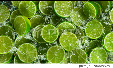 Freeze Motion Shot of Splashing Fresh Limes, Close-up. 96889529