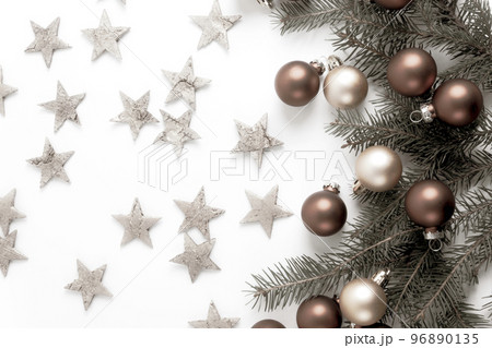 Christmas decorations with golden stars on a white background. Greetings card. Flat lay. Copy space. Christmas decorations with golden stars on a white background. Greetings card. Flat lay. Copy space. 96890135
