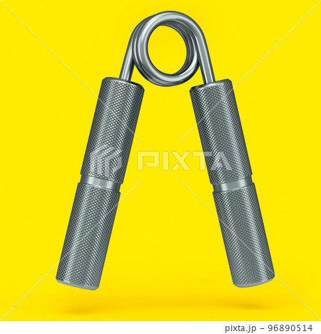 Iron hand expander or resistance band isolated on yellow background. Iron hand expander or resistance band isolated on yellow background. 96890514