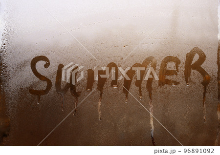 Summer inscription on the texture with condensation on the glass. Summer inscription on the texture with condensation on the glass. 96891092