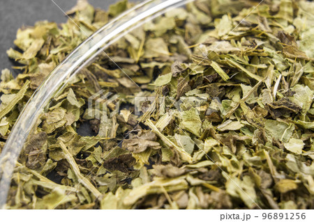 Medicinal milk thistle dried leaves. Alternative herb medicine ingredient. Macro 96891256