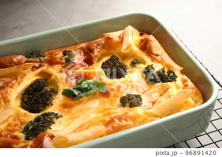 Tasty broccoli casserole in baking dish on cooling rack, closeup Tasty broccoli casserole in baking dish on cooling rack, closeup 96891420