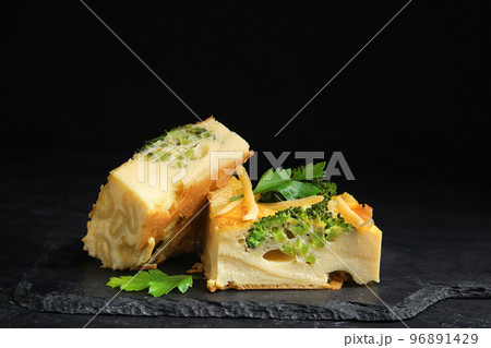Tasty broccoli casserole served on black table 96891429