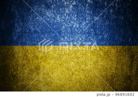 Closeup of grunge Ukraine flag. Dirty Ukraine flag on a metal surface 96891602