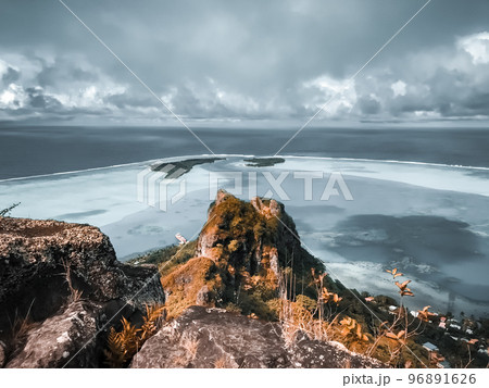 Mountain peak over tropical island blue reef lagoon seascape. Incredible autumn scenery. Scenic mountain landscape. Best famous travel locations, Mt. Teurafaatiu Summit, Maupiti Polynesia Mountain peak over tropical island blue reef lagoon seascape. Incredible autumn scenery. Scenic mountain landscape. Best famous travel locations, Mt. Teurafaatiu Summit, Maupiti Polynesia 96891626