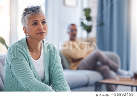 Divorce, fight and sad with couple in living room for depression, fail marriage and toxic partnership. Angry, conflict and frustrated with man and woman on sofa for mental health, crisis and argument 96892459