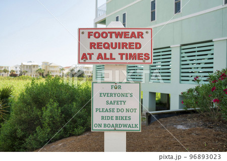 Sign with Footwear Required At All Times and Please Do Not Ride Bikes on Boardwalk at Destin, FL 96893023