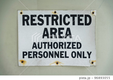 Screwed signage with rust and Restricted Area Authorized Personnel Only- Miami, Florida Screwed signage with rust and Restricted Area Authorized Personnel Only- Miami, Florida 96893055