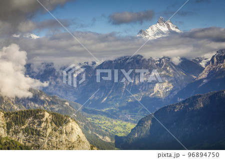 Misty Eiger above Grindelwald valley, Snowcapped Bernese Swiss alps, Switzerland Misty Eiger above Grindelwald valley, Snowcapped Bernese Swiss alps, Switzerland 96894750