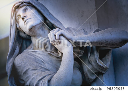 Faithfull Virgin Mary with praying hands and blessing, looking at the sky 96895053