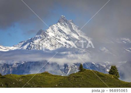 Misty Mountain above Grindelwald, Snowcapped Bernese Swiss alps, Switzerland 96895065