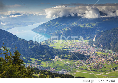 Aerial view of Swiss Alps and Lake Thun at dramatic sunset, Interlaken Aerial view of Swiss Alps and Lake Thun at dramatic sunset, Interlaken 96895288